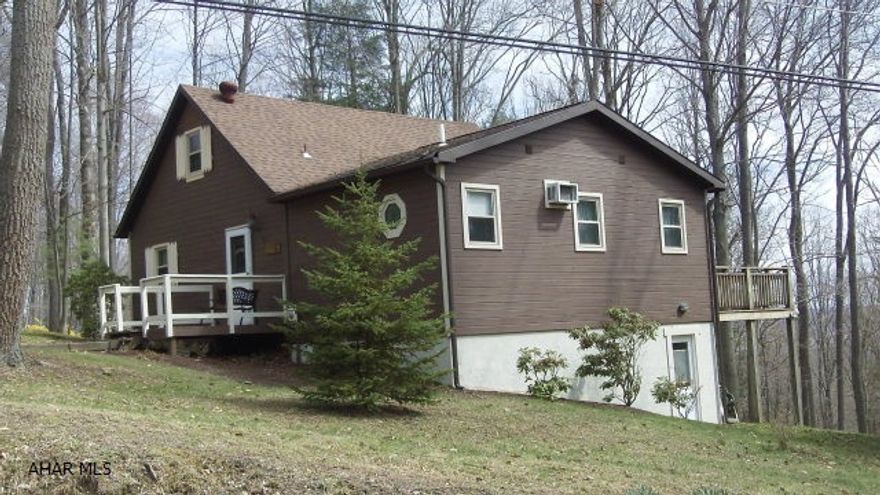 Sitting on the top of the world is where you will be both physically and emotionally when you own this gem.  More room inside and out then it looks from the outside.  Two bedrooms-including a master suite with Jacuzzi tub, 2 full baths, kitchen,LR with wood stove to take the edge off cool summer evenings or keep you toasty in the winter.  Loft adds an extra BR or bonus room.  Back deck has a great look at the woods and the deer that love to visit here.  The basement has room for a workshop and a walk out entrance for convenience. One of the few places in Glendale Yearound that you should have cell service so no land line is needed.  Gated community offers community swimming pool, tennis/basketball/volleyball courts and more.  Adjacent to Glendale Lake and near Rock Run ATV park