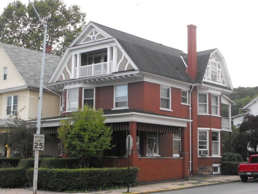 Beautiful home with all natural woodwork & log cabin style hardwood floors.  Stained & leaded glass windows.  Modern oak kitchen & baths.  3rd fl apartment with livingroom, kit, 1 bedroom & bath rents for $400 + elec.  House is owner occupied.  Zoned Town Center Commercial permits many uses