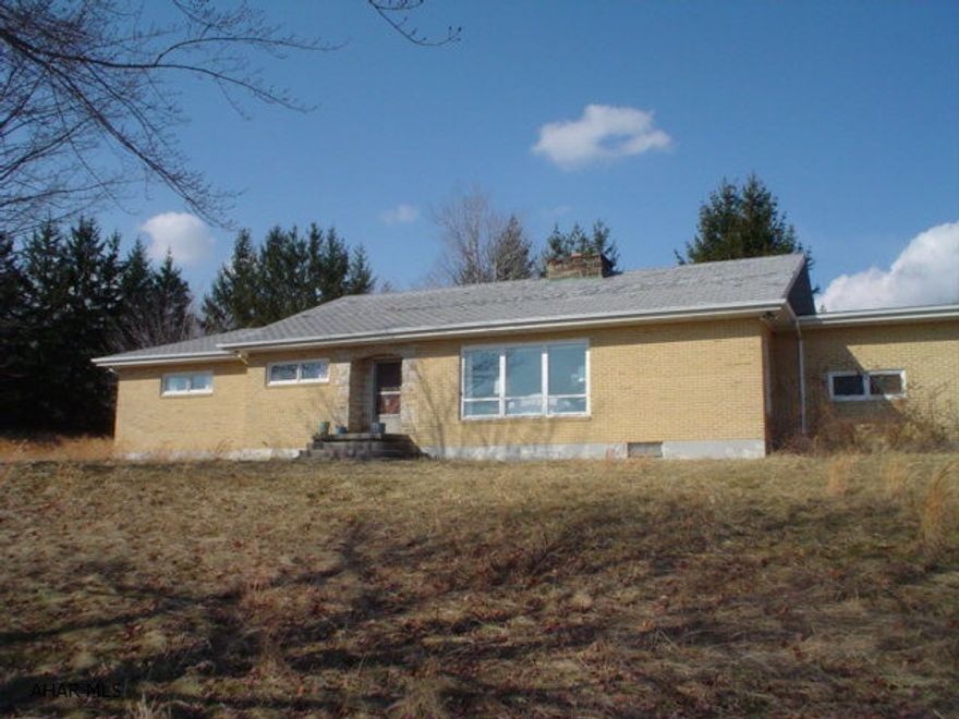 Large brick ranch in Bellwood School District with 13.5 acres. The acreage is both open and wooded with pond and great view. The home is well built  but needs repairs and updating. Adjoining 43.16 acres. Vacant parcel may be purchased for $155,000.