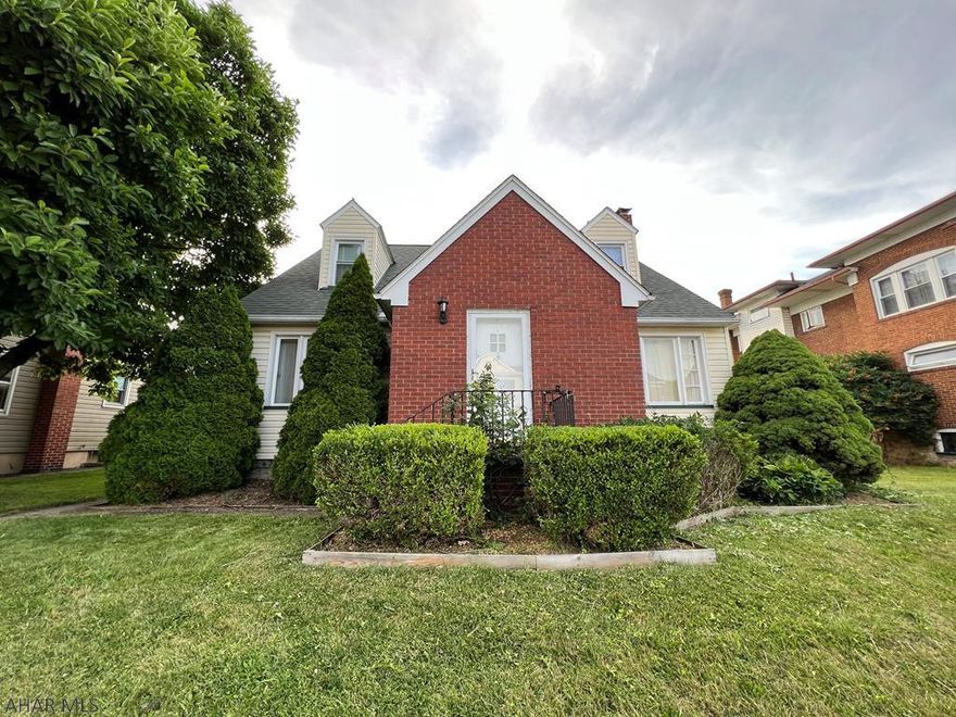 This home has so much to offer.  2 full baths, one on each floor. Main floor laundry and bedroom. Large Livingroom with hardwood floors and electric fireplace. Eat in Kitchen and Dining room.  Second floor offers 3 spacious bedrooms with lots of closet space.  A smaller room as been turned into a walk-in closet with built ins. Nice flat fenced yard that leads to a 23' x 18' garage with additional off-street parking and a large shed.