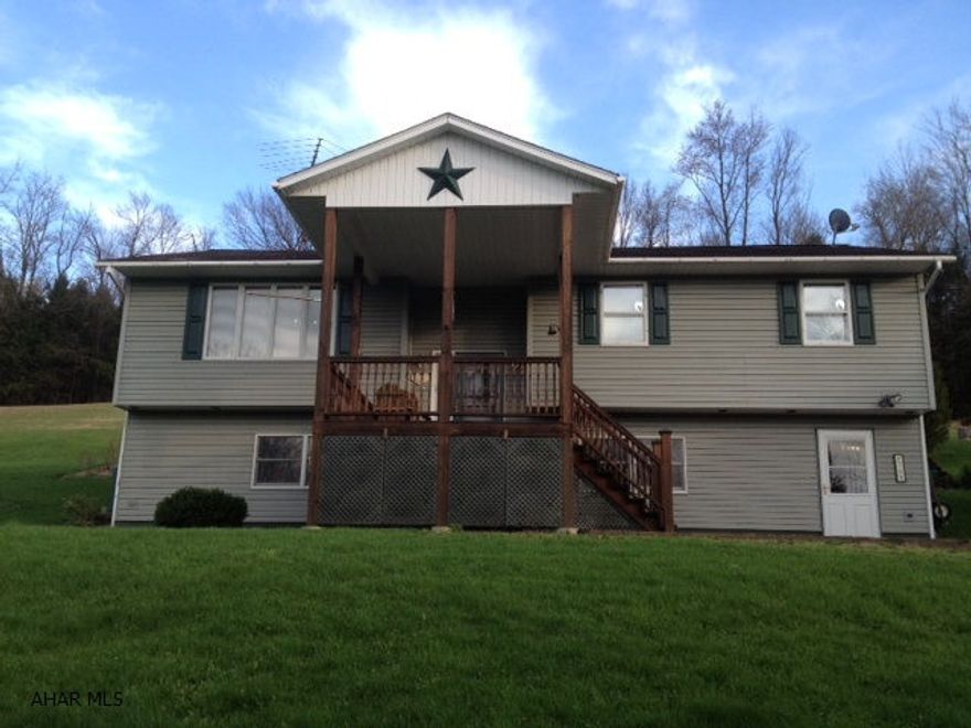 Extremely well maintained home on 9 acres...Brand new oil furnace New Red Oak flooring throughout.. Epoxy floors in baths.. large attic for storageWhole house attic fan.  Water softner. Large front & back decks.  Must see this beautiful location.