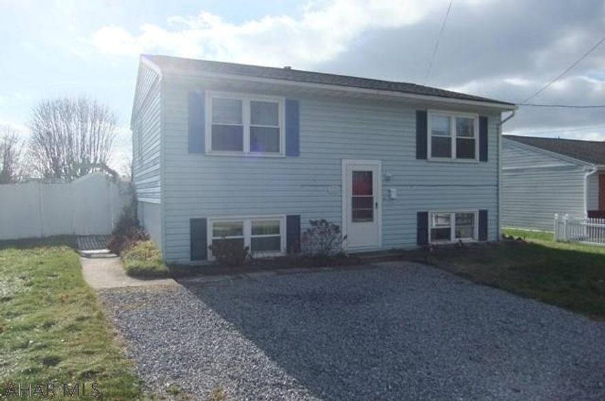 Roaring Spring vinyl Bi-Level in great neighborhood with loads of potential. Large living room with dining combo off kitchen. 2 large bedrooms on first floor plus finished basement with 2 additional bedrooms and bath for loads of living space. Beautiful covered rear deck, large level fenced yard with storage shed. Off street parking and new roof November 2016. Needs some touch-up and finished work, but could be perfect for the right buyer.