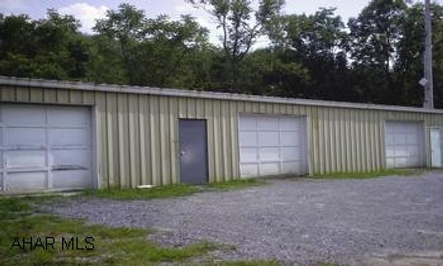 METAL GARAGE BUILDING 90 X 30, 3 GARAGE DOORS, AIR COMPRESSOR, 9K AUTO LIFT, COMM SHELVING, OIL HEAT/CENTRAL AIR, 10X12 FINISHED OFFICE