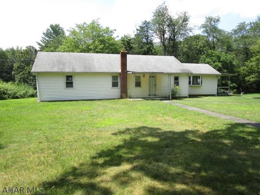 This ranch homes contains 1,466 square feet and rests on a full basement.  It offers a living room, dining room, kitchen, two bedrooms and a full bathroom.  Updated 200-amp electric, oil forced air heat and central air-conditioning.  Front and side covered porches and a level lot with mature trees.  Large three-car detached garage.  Nice location just a few miles south of the Omni Bedford Springs Resort and downtown Bedford.