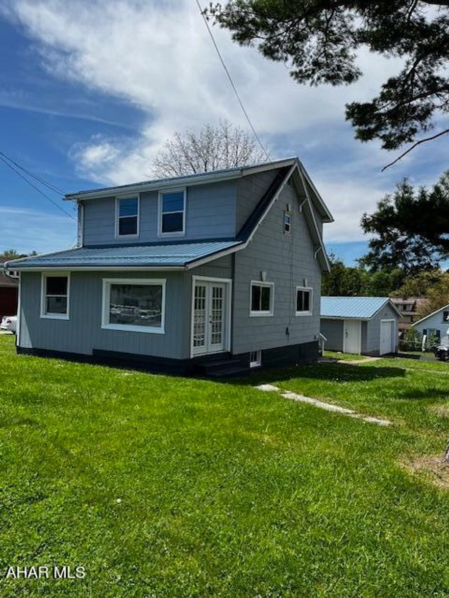 'A shining star' located near convenient and desirable amenities .   Setting the tone... are the amazing hardwood floors, lovingly restored and/or replaced throughout the entire home.  The efficient Kitchen has new appliances, new cabinets, & new Quartz, countertops, crown molding throughout, private composite deck, oversized garage, paved driveway, new windows, mud room, office, updated bathroom, ample room sizes., bonus basement potty and more...