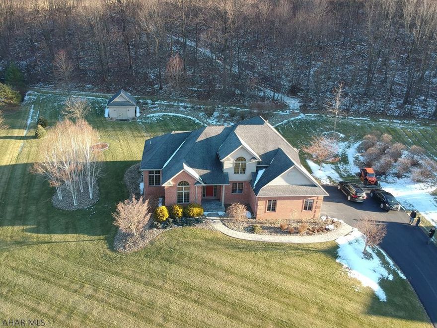 Don't miss the opportunity to view this meticulous, spacious home that is situated on a beautifully landscaped partially wooded 1.56 acre lot.   This home offers beautiful views, privacy, nature at it's best, hardwood floors, main floor living, high ceilings, an attached  2 car garage and a large basement that is plumbed and ready for a new buyer to make it whatever they desire.