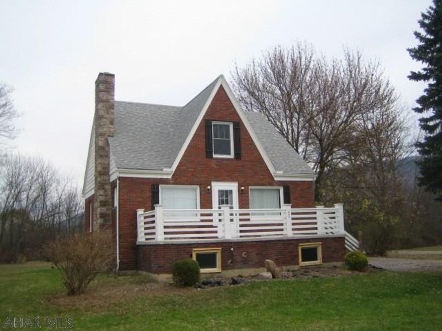 Fabulous brick Hollidaysburg home on one acre & completely remodeled throughout! Convenient 1st floor bedroom and bath. Beautiful, newer kitchen with sun room eating area. Spacious living room with fireplace, newer baths with ceramic tile, beautiful hardwood floors, freshly painted interior and all new wall to wall carpeting. Newer thermo windows & roof. Just move in!
