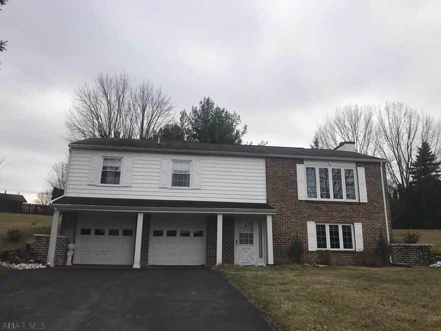 If you are looking for a home in Penn Farms this is the one ! Upon entering this home, you will notice a large family room with an gas burning fireplace and mini-bar, newer carpet and exposed wood ceilings. The gorgeous staircase leads to the second floor. The open common areas include a bright living room, dining area and kitchen that features  hardwood floors, high ceilings and exposed wood beams. The kitchen offers upgraded Corian counter tops,appliances and walnut cabinetry. The large living room offers vaulted ceilings, a large bay window allowing for plenty of natural light. This floor also offers a master bedroom with a private bath, and two more bedrooms. This is the perfect family home in Hollidaysburg School Dist. Radon system in place, newer furnace