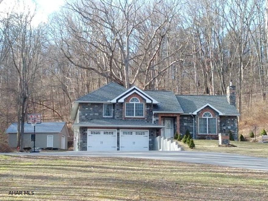 Beautiful 4 level split home, vinyl siding, bright home with custom made cabinets, granite counters, ceramic tile floors, hardwood flooring and carpet. Bedrooms have walk-in closets. 2 car garage plus 2 car detached heated garage.   J-180