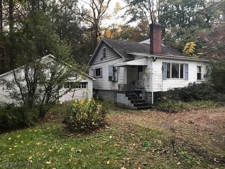 Unique country style home with beautiful hardwood and trim throughout. Large rooms, dual sided fireplace. 21x18 shed w/ electric. TLC gives this house huge potential.