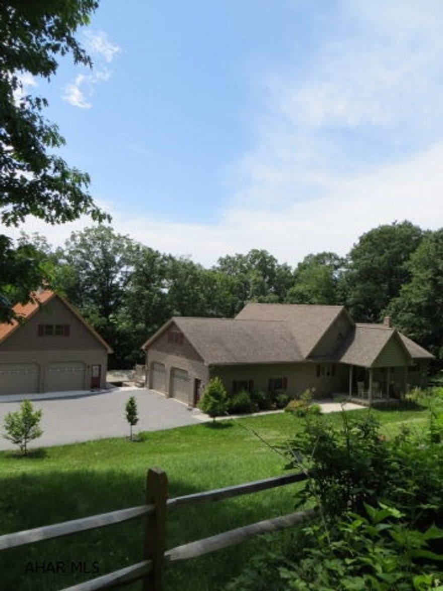 Awesome three bed three bath home in the Spring Cove School District. Home features vaulted ceilings made of wood, a wood loft over the kitchen area, and Hickory hard wood floors with radiant heat. Great room has a gas fireplace and the spacious family room down stairs has a gas wood burner as well as baseboard heat. The house sits on 3 acres with an additional three story two car garage and an enclosed outdoor pavilion for entertaining. This hidden gem is close to everything but in a very private setting with great views.  Owners will look at all reasonable offers.