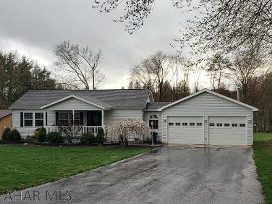 Beautiful setting. Immaculate 2001 Champion Home w/3 bedrooms, 2 baths, finished basement, oak cupboards, vinyl-tilt windows, architectural shingle room, 24x36 attached garage w/attic, 10x12 shed, castle playhouse & hottub on 100x421 spacious lot.  J-541
