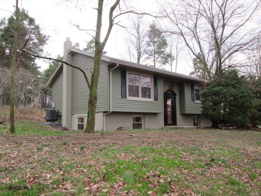 Beautiful bi-level in Hollidaysburg school district! Gorgeous eat-in kitchen that features tile floors, new cabinets, new appliances, and a center island.  Fantastic living room that is very spacious.  New carpet throughout the main level.  Impressive family room in the lower level that would be great for entertaining.  Home has 2 full bathrooms that have been remodeled with tile floors.  Exterior has new vinyl siding and all new windows.  Home sits on a huge lot.  This home is like new and is worth a look!!