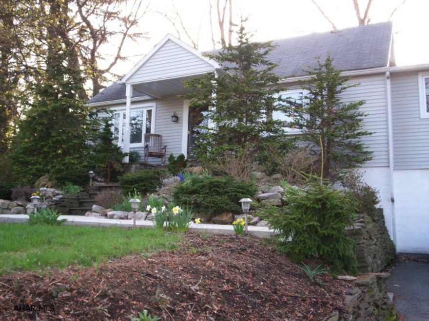 Gorgeous 4 bedroom Cape Cod hardwood floors, extra bonus room with a beautiful fenced in back yard.