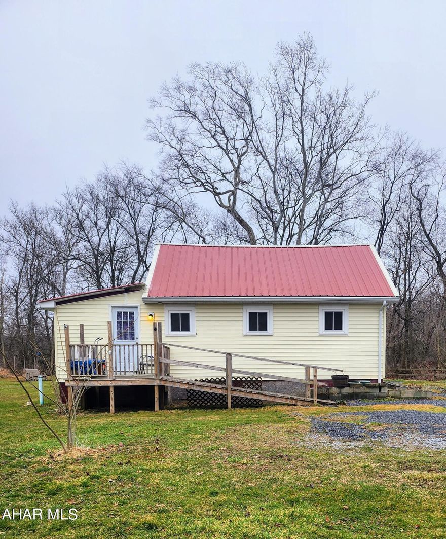 **Tranquil Retreat with Creek Views**

Address: 396 Wayne Blvd, Alum Bank, PA 15521

This charming cottage, nestled in Alum Bank's serene landscape, offers a tranquil retreat on 0.67 acres. Featuring 2 bedrooms, 1 bath, a kitchen, living room, enclosed back porch, shed, and a convenient leanto, it provides comfortable living spaces with scenic views of Dunnings Creek.

Embrace the outdoor lifestyle with fishing, swimming, and outdoor BBQs right in your backyard, with Dunnings Creek providing a picturesque backdrop for relaxation and recreation. The attic could be finished to accommodate more sleeping space, offering flexibility and room for expansion.

Conveniently located just 2 minutes away from the Grandview Golf Course, indulge in leisurely rounds of golf amidst breathtaking scenery.

Don't miss the chance to own this idyllic retreat.