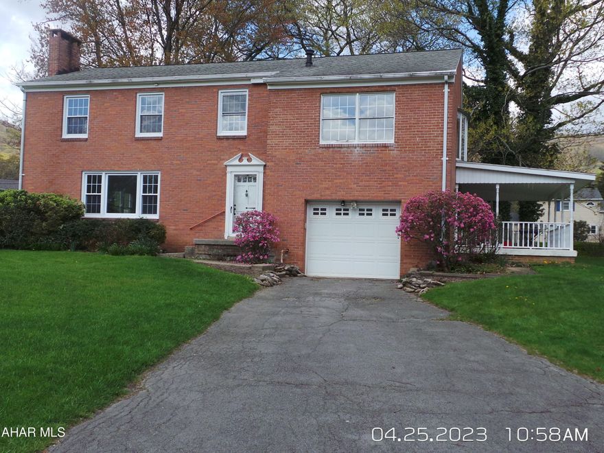 Beautiful 2 story brick home with 3 - 4 bedrooms, large rooms, new floor coverings, updated kitchen w/ new appliances, updated  bathrooms, freshly painted interior and more! 1st floor bonus room with laundry hook ups.  2nd floor offers a Large bonus or 4th bedroom with door to spiral staircase that leads to the back yard and an additional bath could be added (plumbing is there). Enjoy the nice covered side porch and  lovely flat and mature lot.