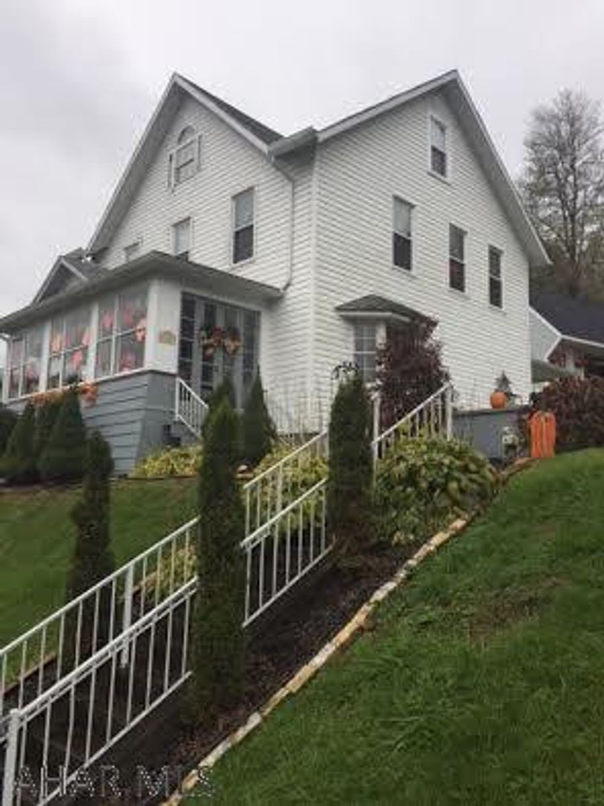 The pride in ownership is evident the moment you walk in to this immaculately kept home. Sitting on over an acre, this property is completely updated and move-in-ready! You don't need to do a thing to this 3 bedroom home that has been remodeled with meticulous care. Newer roof, siding, insulation and windows. Built in shelves in the dining room add a nice touch of charm to the interior of the house. The bright sunroom begs you to sit and relax with your morning coffee. The large living room with the beautiful bay window makes it a perfect place for family to gather. The attic has been completely finished into a spacious playroom/movie room with storage. You can also find tons of attic storage above the two car detached garage. This house is a gem!