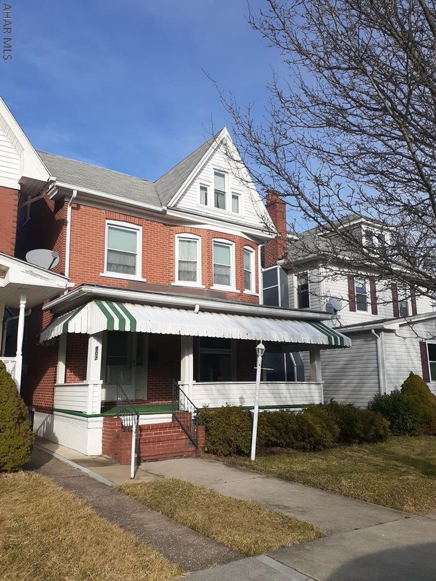 Large brick beauty located in a great section of Juniata and minutes from Penn State Altoona. This move in ready home has 3 bedrooms and finished, heated attic. There is hardwood under the carpet downstairs. Unaware of condition. Spacious yard and 2 car detached garage.