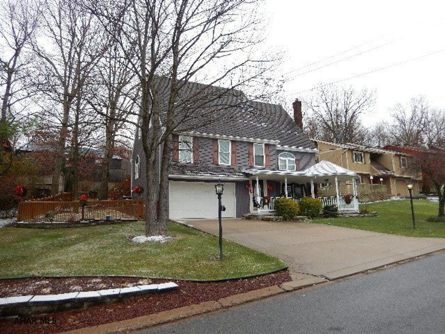 Impressive 3 story home near Altoona Penn State Campus!  4 large bedrooms, 2 1/2 baths, spacious rooms and is completely updated!  Appliances in the over-sized eat-in kitchen! Kitchen also offers a custom wine rack, sitting area, bar, 2 lazy susan cabinets and so much more!! The large family room features a gas fireplace and 1/2 bath. Main floor master bedroom with an abundance of closet space and full bath.  The master bath boasts a huge 2 person jacuzzi tub, step in seated shower.  Entertain on the easy to access deck with fenced yard!  Please ask for brochure for more details!!