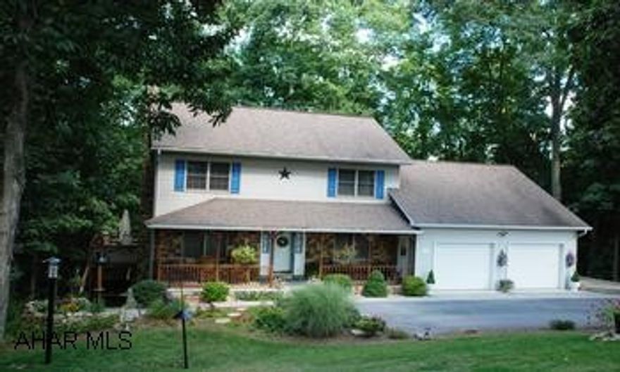 Beautiful 2 story 3 Bedroom 2.5 bath on 2.58 acres (a private setting) in the Juniata Mills delopement.Central Vacum, heat pump, propane fireplace, Hickory kitchen cabinets, tile floor and a whirlpool tub. Lush landscaping , covered porch and decks. Home is a must see, stone faced and vinyl two story. lovely setting on 2.58 acres in Juniata Mills developement on its own private setting. hickory cabinets, whirlpool tub,full finished basement with a gas stove and french doors to access patio, oversized garage, large deck, attic storage, paved driveway, oak trim through out the home, overlooks the Juniata River.