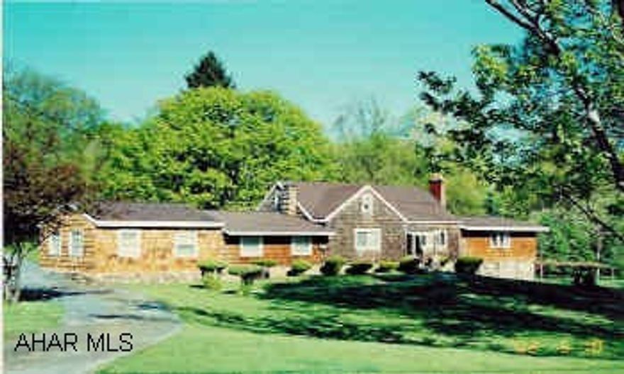 Cedar shingled home on 4.1 acres. Anderson windows, hardwood floors, new oak kitchen, 2 fireplaces.
