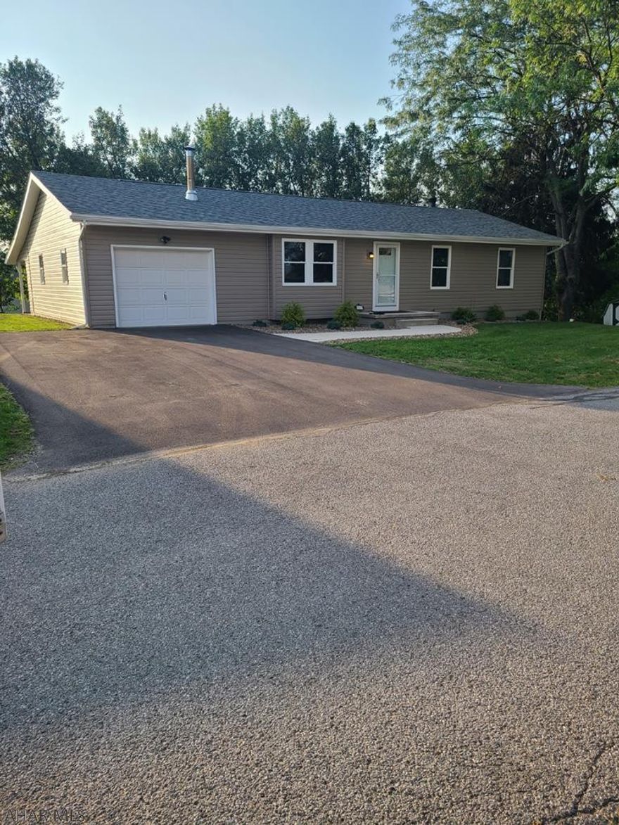Completely remodeled 3 bedroom, 1.5 bath home in the East End area. This home has been completely updated from top to bottom! Updates include new sewer line and hook up, new LED lighting, windows, siding, roof, soffit & fascia, driveway, sidewalk, new 200 AMP electrical service, doors, paint, drywall, flooring, carpet, counter tops, new high-efficiency heat pump & many other cosmetic updates! Upstairs you will find a spacious living room with plenty of natural lighting. A full bath is just down the hallway. You will also find three bedrooms, the master has its own half bath. Downstairs is finished, with an unfinished utility room and an added bonus room perfect for an office. 1 car garage with new metal ceiling and drywall. Enjoy summer night on covered patio out back.