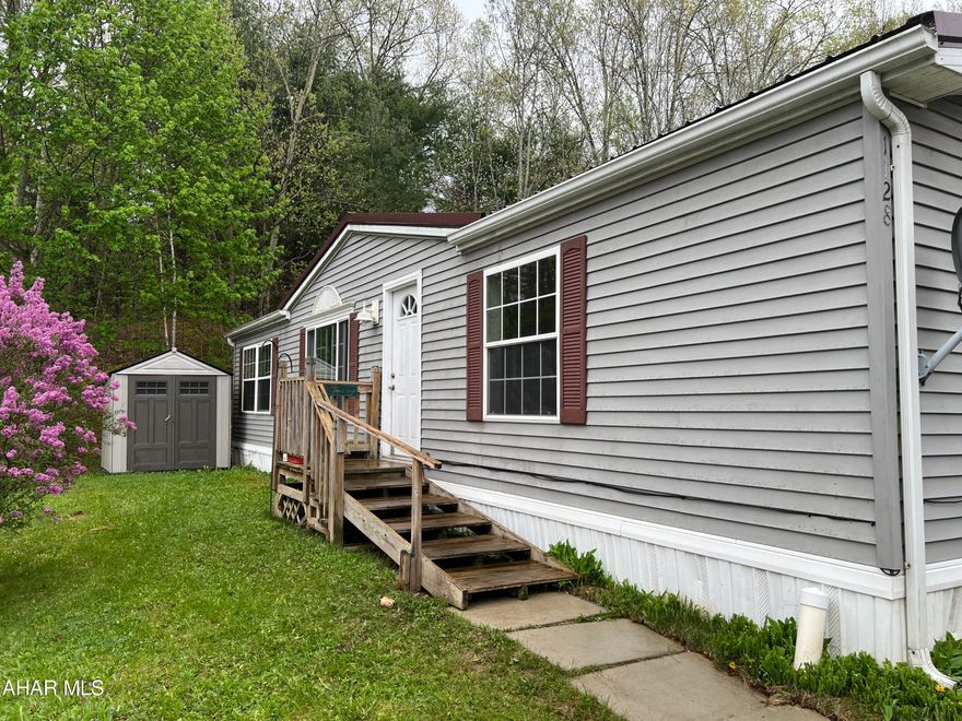 This 3 bedroom, 2 bath manufactured home offers spacious closets and large living spaces. Although it needs some repairs, it provides great potential for customization and improvements. In addition to the main structure, there are also two storage sheds included, offering ample space for storing tools, equipment or other belongings. Lot rental is $415 a month and includes expanded, basic HD cable. Property being sold AS-IS Where Is.