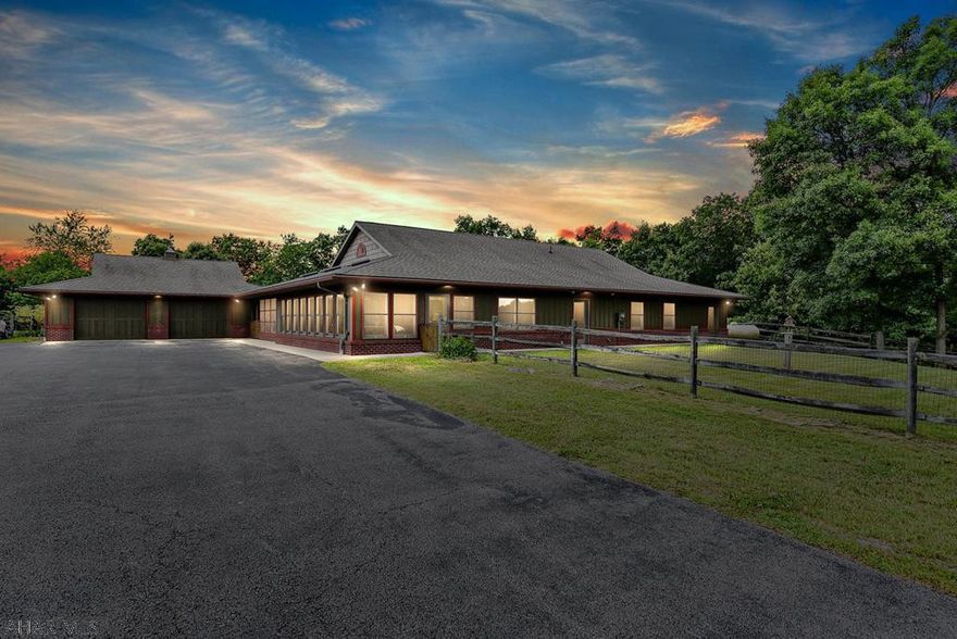 A Wow Factor Home!  From the magnificent views in a private tranquil setting, to a home where no detail was overlooked, this home will surely impress even the most discriminating buyer.  One floor living at it's best which includes radiant floor heating throughout, two master bedroom suites with wheelchair accessibility, huge sunroom, skylights, laundry room, covered porch and 2 car oversized garage.  Kitchen overlooks the huge family room and dining room with beautiful wood cabinets, solid wood doors and trim throughout.  A covered back terrace is surrounded by nature and one will be mesmerized with the beauty that surrounds this gorgeous setting.  Added to this is the 5 horse barn and fenced pastures.  See drone video attached to appreciate this stunning home.