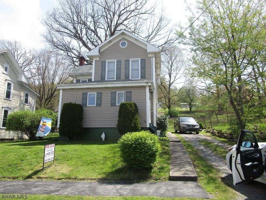 Remodeled vinyl sided two story home. 3 bedrooms, oil and coal hot water heat. Oil furnace replaced approx. 1 year ago. Large rear deck.  Very nice home for the $$.