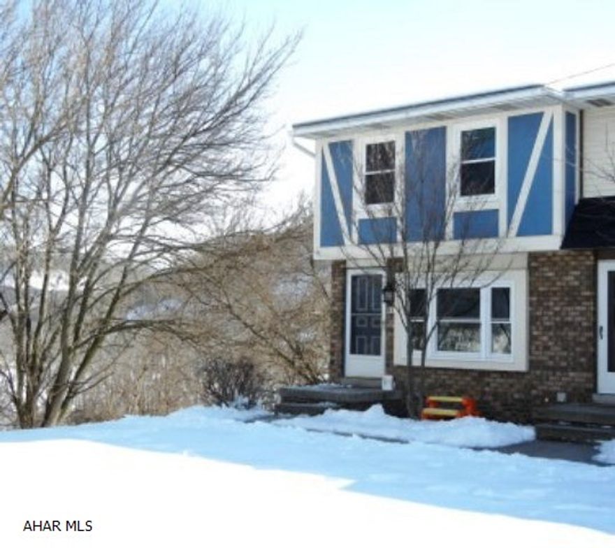 This END UNIT OF END BUILDING has a wrap-around deck (off the kitchen),patio (off the family room),a fenced in yard, and a view. So many updates too: Kitchen has new laminant tile floor, cabinates, countertops and appliances. Living room has new laminant wood floor. Basement family room has new carpet, bar, fireplace and pool table. Water heater 2009. New windows 2013. Roof 1997. Just move in!