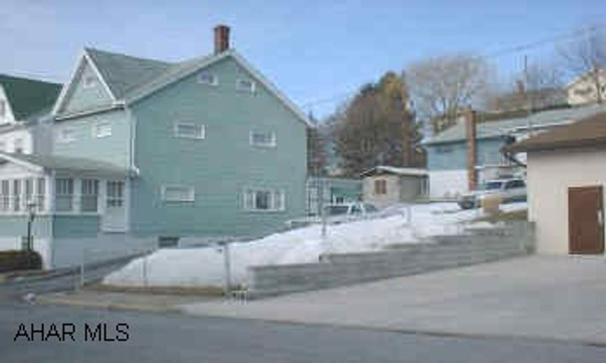 PROPERTY IS FENCED AND FEATURES A SECOND DETACHED 2 CAR GARAGE.  ALSO HAS A 2 BEDROOM APARTMENT NOW VACANT.  MAIN HOUSE HAS SECONDARY HOT WATER HEAT SOURCE WITH CENTRAL A/C.