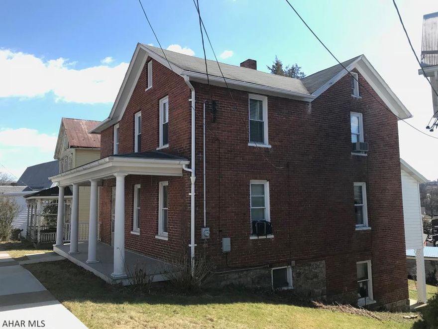 1900s charm at it's best! With a few cosmetic updates this solid brick house would be the perfect family home with character. This home features beautiful moldings and wood craftsmanship throughout. The foyer has multiple stained glass windows that were preserved, along with a vintage chandelier. Hardwood floors are present underneath at least some of the carpets. Three ample bedrooms and 2 baths. One bath features a claw foot tub in immaculate condition. Some major updates have been completed including 200 amp electric and thermo-pane windows. First floor laundry is also an option. This home is a rarity in that it features an oversized three car garage in the borough. Set up your showing today!