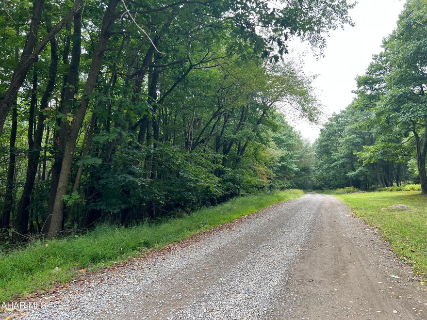 Nice wooded 5+/- acre lot to build your dream home or weekend getaway on. With some clearing of trees you could have a nice view of the Mountains. Located near State Game lands, Shawnee State Park, Indian Lake, and much more! Property is part of Folmont Property Owner Association.