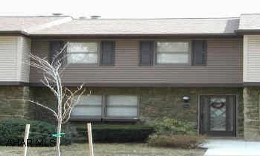 Meticulously maintained, 2 story townhouse - with wonderful view from rear deck Ceramic tile in kitchen, bathrooms, laundry room, newer appliances included, sunken living room w/ gas fireplace, family room lower level, siding and roof replaced wth last 3 years approx. $50 assoc fee includes garbage removal, snow removal, lawn/shrubbery care