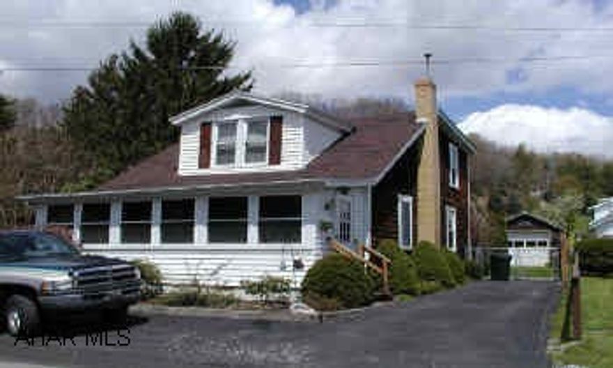 Large landscaped corner lot.  Nice 2 Cape Cod style home with 3 bedrooms.  Gas heat, central airconditioning.  Replacement windows. Lovely home, move-in condition.  Separate garage.