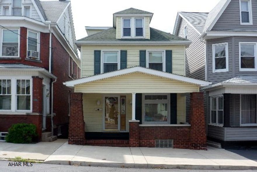 Be The Proud Owner!  Well maintained 3 BR, new BA, LR with electric fireplace, open staircase, and stained glass windows, formal dining room with an offset as a computer room or perfect space for a second bath.  LR/DR dual staircase, Eat-In-Kitchen with dishwasher, range, disposal, and toe kick heater under pantry, large lighted closets throughout, hardwood floors under carpet on first level.  Updates include windows, bath, kitchen, hot water furnace, blown insulation in all walls, vinyl fence, flue re-pointed, roof, siding, and alarm system.  2-Car Garage, manicured yard...move right in...$79,900