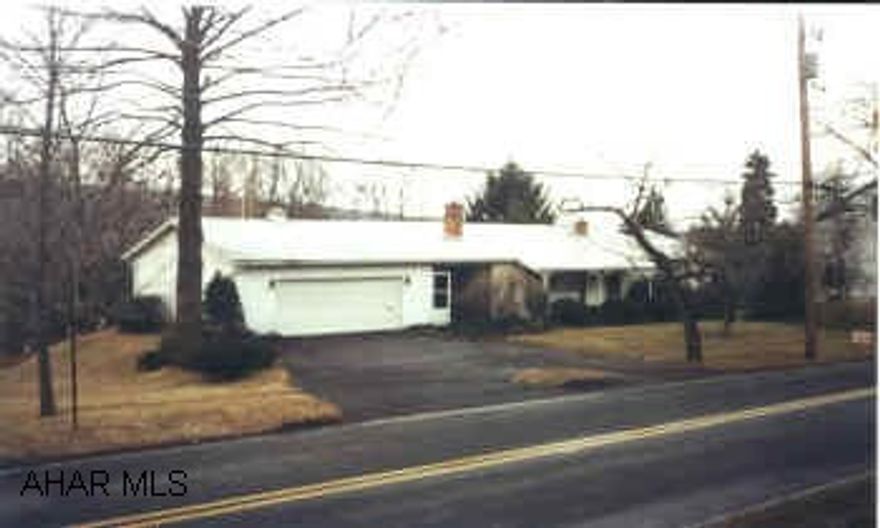 Very attractive rancher in Eldorado.  2 bedrooms, 2 car attached garage, central AC.