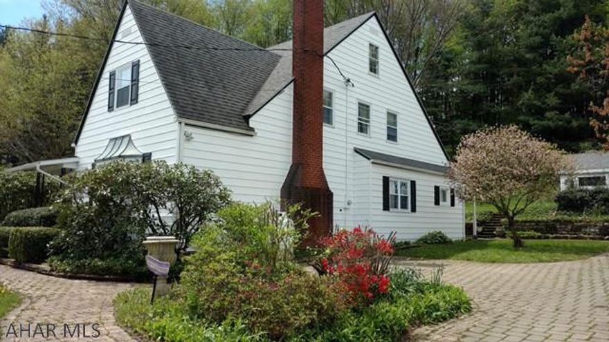 This unique and spaceous two story one of a kind home nestled into its own natural beauty with a cobblestone driveway leading to a two story garage is waiting for you to make it your own.Property offers an out building for your gardening tools or work space/studio,a copper roof over the front bay window,covered porches on both the front and back of the house and hardwood floors are waiting to be discovered throughout .There is plenty of outdoor space for cook outs or gardening.This home has been well maintained and offers separate zones for your heating comfort.Make your appointment today to come see this beautiful home. All respectful offers will be considered.Hardwood floors in LR and DR under carpet.Additional lot tax I.D. 35-007.-121.000