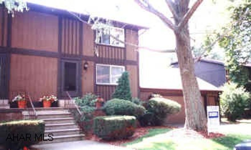 UNIQUE TOWNHOUSE WITH ATTACHED 2 CAR GARAGE WITH TREMENDOUS STORAGE ABOVE. 2 FAMILY ROOMS.