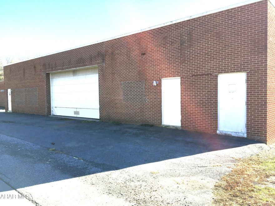 Large commercial space for lease. Could be used for many purposes. Has 2 office areas, 2 bathrooms . The rest of the space is open with 2 overhead doors, one is a loading dock. Tenant will pays all utilities including water and sewer. Heat is natural gas from the ceiling , offices have baseboard electric and wall unit cooling. New carpet recently installed in offices. Over 5000 square feet. Security System available but would need hooked up by tenant if wanted. Good location. Is ready for immediate occupancy. Call to take a look!