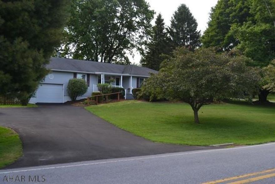 This ranch style home is situated on 2 large lots in Cresson Twp. Fenced in backyard with large deck. 1 car attached garage & 2 car detached garage with wood burner. New driveway. This home boasts hardwood floors, open concept living room with a picture window- Allowing lots of natural light.  1st floor laundry. Decks with new plank flooring. oak cabinets, ceramic tile and much more!