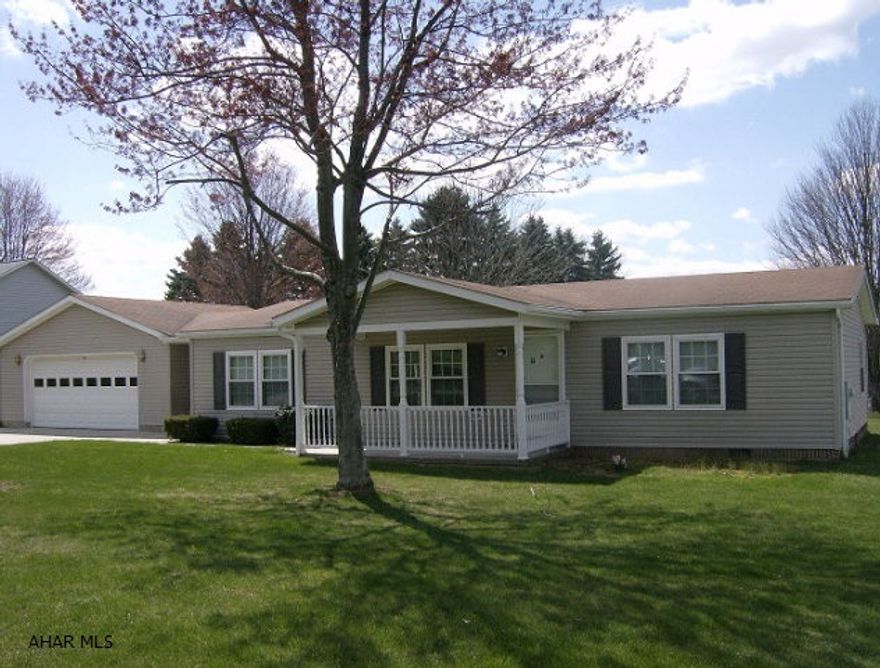 Forest Hills schools- 3 BR, 2 bath vinyl sided manufactured home on crawl space. Electric Baseboard heat. Appliances included. 2 car attached garage Located on 100 x 200 ft lot.  Great location!