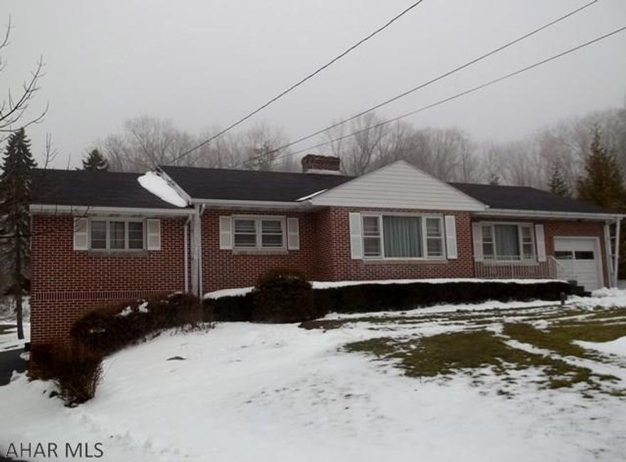 If you are looking for an all brick custom built home with 1 floor living, this is it!  Check out the macadam drive that encircles the house, 4 BR, 2 BA, CA, stone fireplace, partially finished basement, 1.4 acre lot, and lots of woods in the rear for privacy.  Small Barn has stalls for horses and an attached kennel.