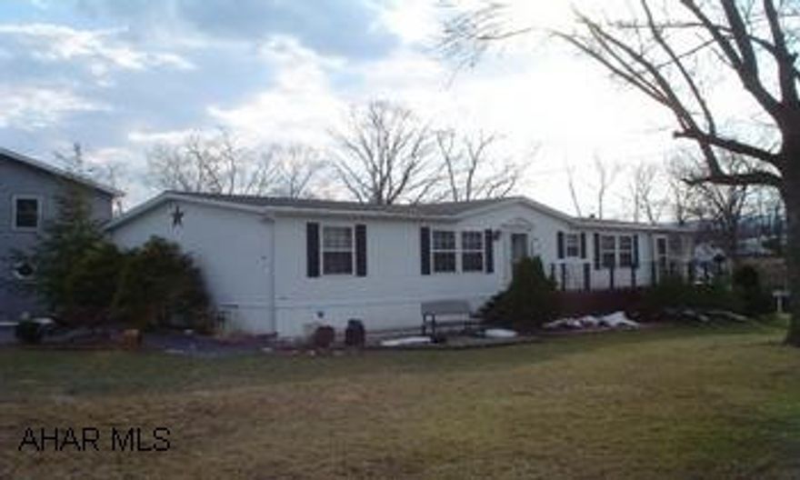 Immaculate manufactured home on large owned lot in a nice residential neighborhood featuring an enclosed porch, pool, CA, and sheds, garden tub.