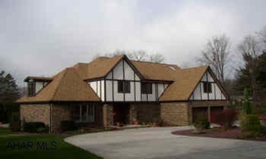 THIS HOME IS ON A GORGEOUS PRIVATE LOT IN SYLVAN HILLS.  INDOOR POOL WITH WET BAR AND EXERCISE ROOM.  MANY SPECIAL FEATURES WITH THIS HOME.  5 ZONED HOT WATER HEAT, LARGE FINISHED BASEMENT, GREAT ATTIC STORAGE, SECURITY SYSTEM, NEW CARPET IN FAMILY ROOM BOTH UPSTAIRS AND DOWN.