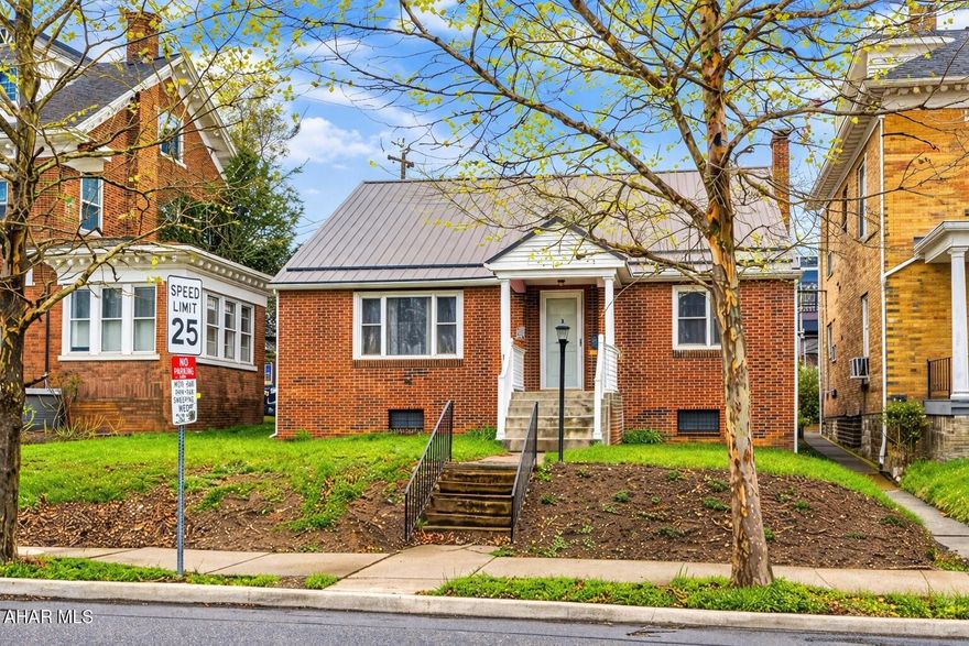 Adorable house in such a convenient location.  This sweet all brick cape cod style home has 2 bedrooms on the first floor and a 3rd bedroom on the 3rd floor. Large eat in kitchen with modern amenities, open dining room and super large nostalgic living room that has original knotty pine panels. Let's make this one yours!
