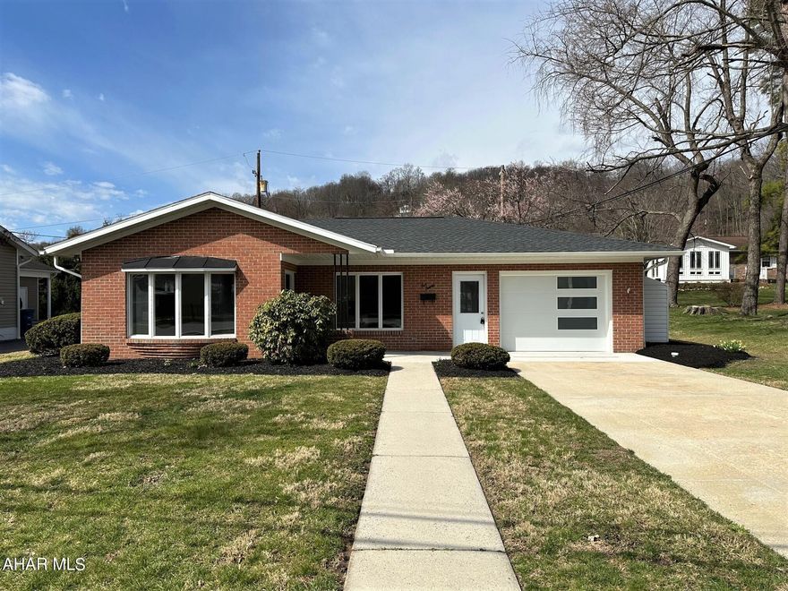 Remarkable brick ranch home located in the Bedford Borough. Resting just one half block off S. Juliana Street, this beautiful home has just undergone an extensive renovation. Featuring a large living room with bay window; kitchen with Handstone Quartz counters, breakfast nook, black stainless steel appliances, and subway tile backsplash; dining or family room with stone hearth fireplace; owner's suite bedroom w/ bath; light and airy sunroom just off the master suite for morning and evening relaxing; two additional bedrooms and another full cer. tile bath. One-car attached and finished garage that is also heated and cooled, and laundry room. New heat pump with central-air; water heater; 200-amp electric and new exterior sewer line certified by the borough. New lifetime transferable shingle roof; new interior doors and hardware; garage and overhead doors; oversized trim work, tile and carpet; tiled baths; recessed LED lighting; and much more. Just blocks from the downtown area, Bedford Elks, Omni Bedford Springs Resort and convenient to all amenities. Easy one floor living with zero steps into the home.  HOME WARRANTY!