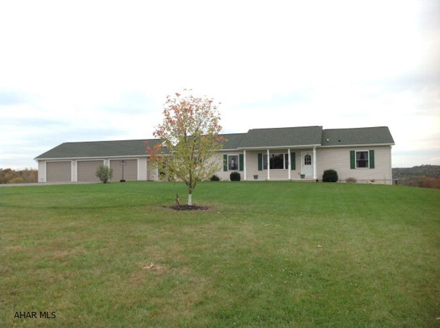 Very well maintained 2006 ranch home on 29.93 acres with spectacular, panoramic views!!! Open fields and woods surround this 2006 home. Spacious rooms with beautiful views from almost every window. Large 3 car garage with furnace and 1/2 bath... and a nice workshop area.  Unfinished basement can be finished easy with high ceilings and the french doors are in place for easy access to the outside.  Approx. 9-10 acres of mature wooded land and approx. 20 acres of open/tillable land. Local farmer bales approx. 30 round bales.