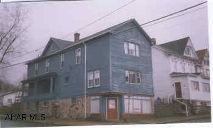 Possible store front on first level needs finished.  Duplex in very nice condition, new roof in 1997.  Gutter and downspot, new copper plumbing, curcuit breakers and water heater 1997.  Tenants pay all utilities, gas, elec, w/s, trash, laudry for 1st floor appt.