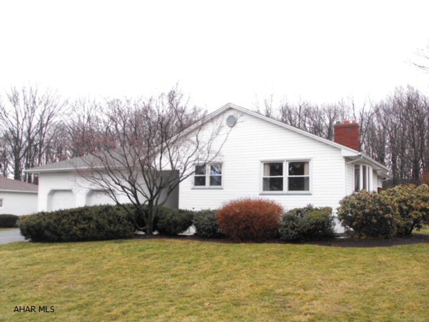 Super floor plan w/large bright rooms.  New custom made oak kitchen with ceramic tile floor & stainless steel appliances.  Beautifully refinished hardwood floors throughout.  Basement has rough in for bath.  Gas fireplace with remote in the living room & a woodburner in basement.